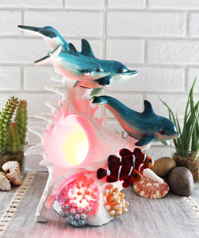 Ebros Gift Ebros Nautical Ocean Family 3 Dolphins Swimming Over Giant Sea Conch Clownfishes And Anemones Statue With Colorful LED Light 9.5" Tall
