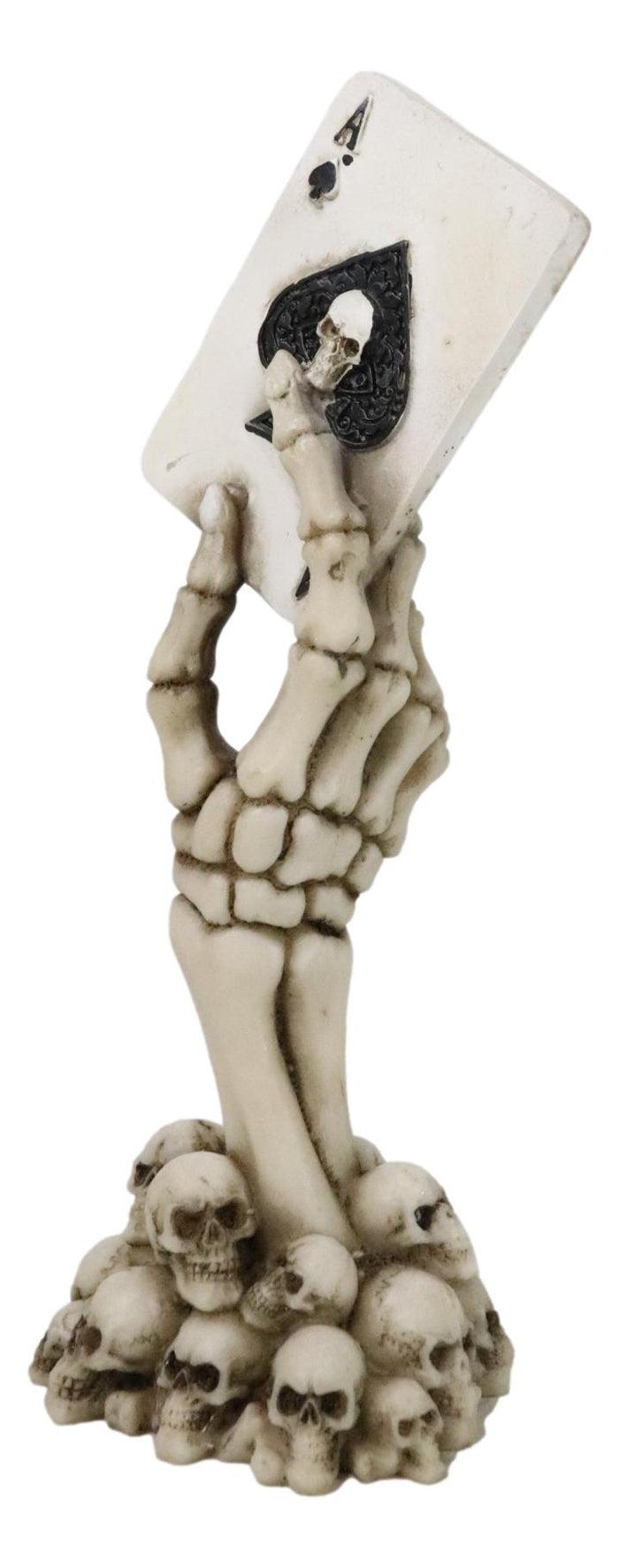 ebros gift Gothic Skeleton Hand With Skull Ace of Spades Card On Ossuary Graveyard Figurine