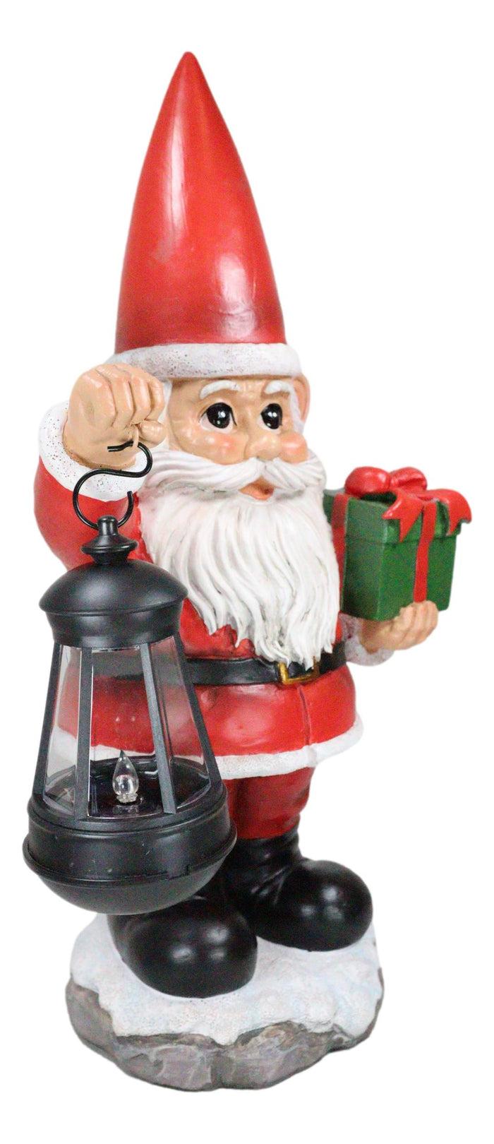 Ebros Gift Merry Christmas Santa Claus Holding Gift And Solar Colorful LED Lantern Statue