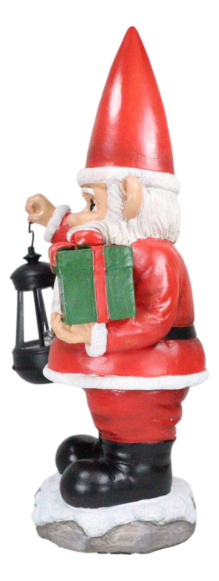 Ebros Gift Merry Christmas Santa Claus Holding Gift And Solar Colorful LED Lantern Statue