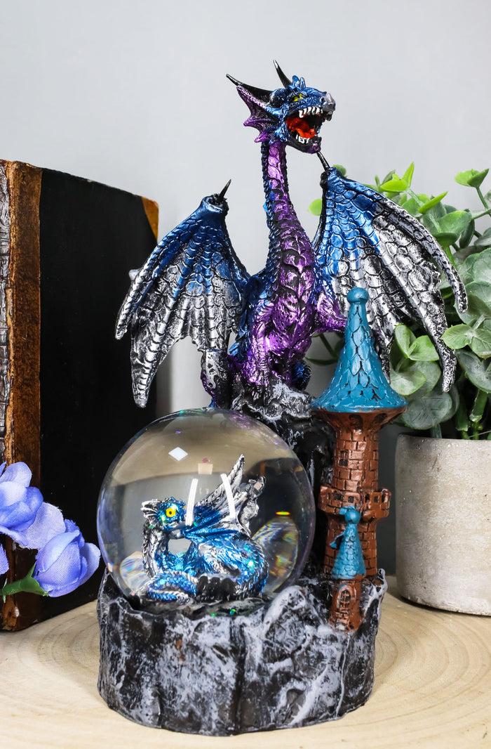 Ebros Gift Metallic Blue Dragon On Cliff Rocks Castle With A Wyrmling Water Globe Statue