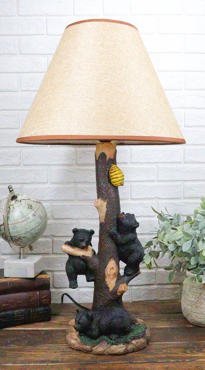 ebros gift Rustic Forest Climbing 3 Black Bear Cubs On Tree Getting Beehive Table Lamp