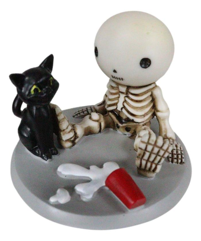 Ebros Gift Unfortunate Skeleton Boy Lucky Sitting By Spilled Milk And Black Cat Figurine