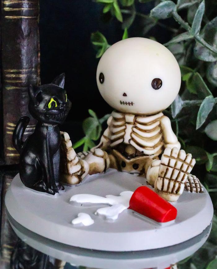 ebros gift Unfortunate Skeleton Boy Lucky Sitting By Spilled Milk And Black Cat Figurine