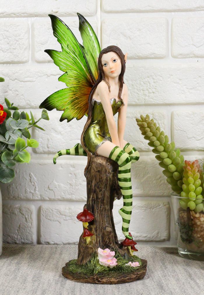 ebros gift Whimsical Peppermint Elf Fairy Sitting On Tree Stump Statue 9.5"Tall Collectible