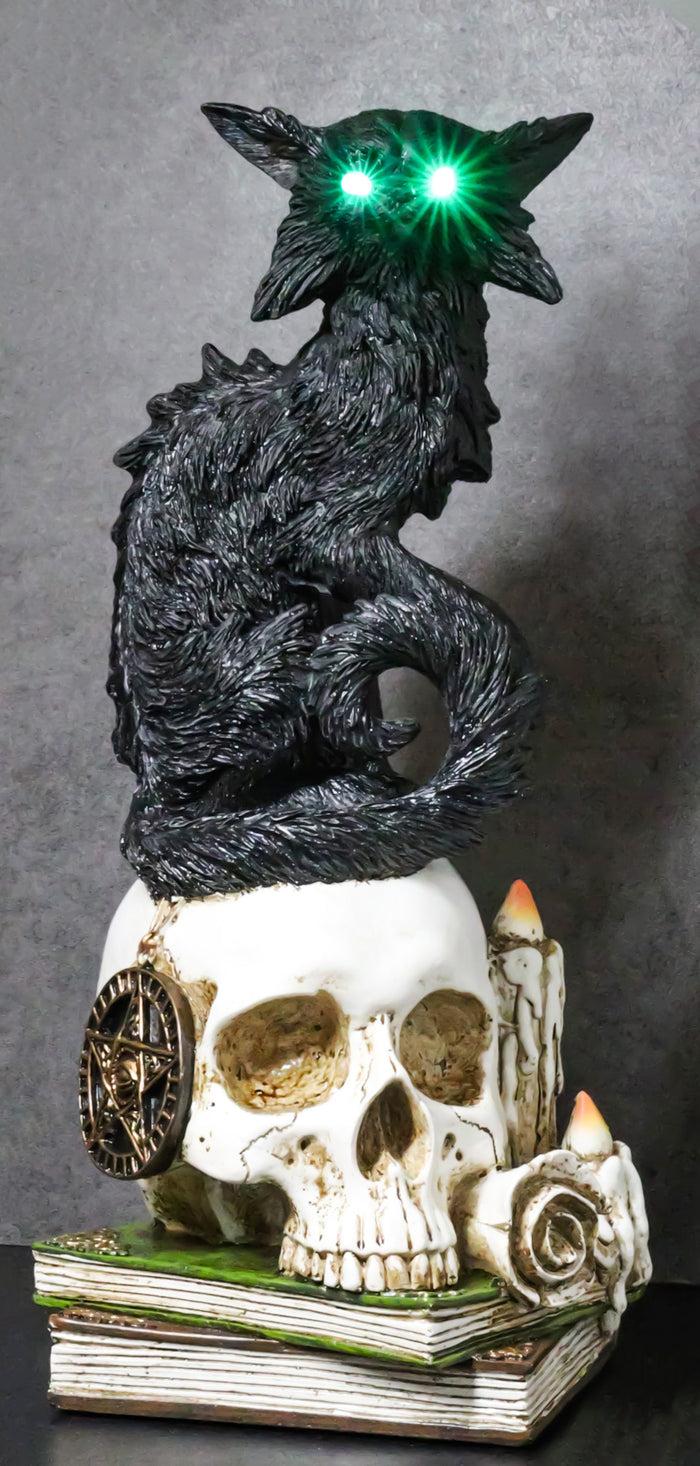 ebros gift Wicca Black Cat With LED Green Eyes On Skull With Pentagram Spell Books Figurine