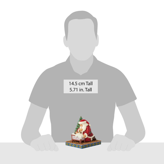 Endura Santa Kneeling Over Baby Jesus