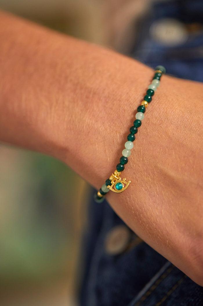Estella Bartlett Beaded Evil Eye Charm Bracelet Gold Plated | Green Quartz Packaging Message: Positive Vibes