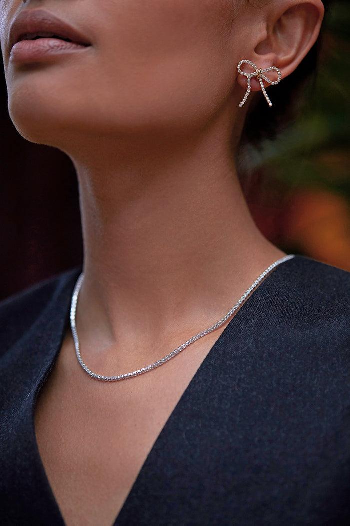 estella Bartlett Bow Tennis Chain Earrings Gold Plated