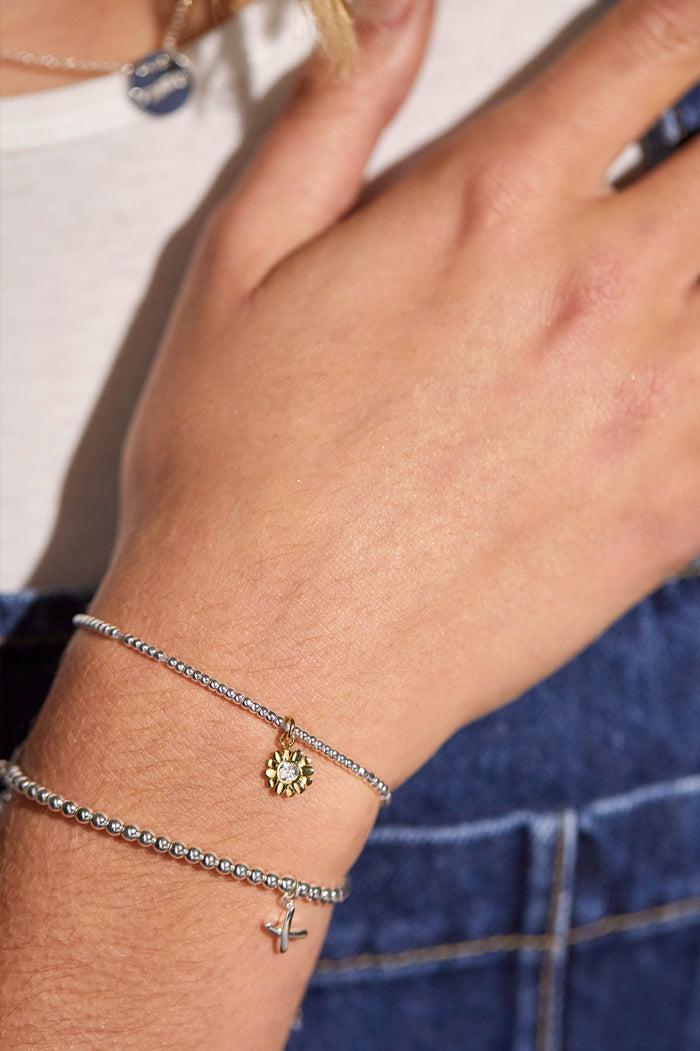Estella Bartlett CZ Flower Charm Bracelet Silver And Gold Plated Packaging Message: Lovely Little Thing