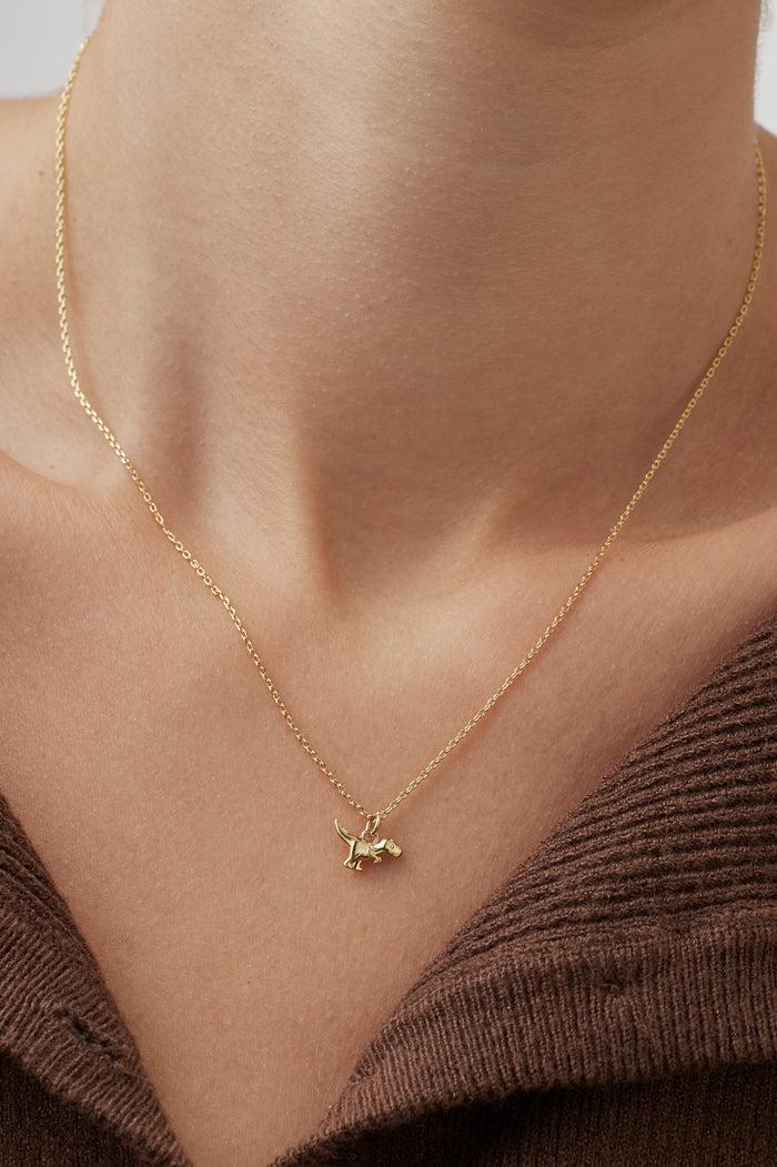 Estella Bartlett Dinosaur Necklace Gold Plated Packaging Message: You're Roarsome