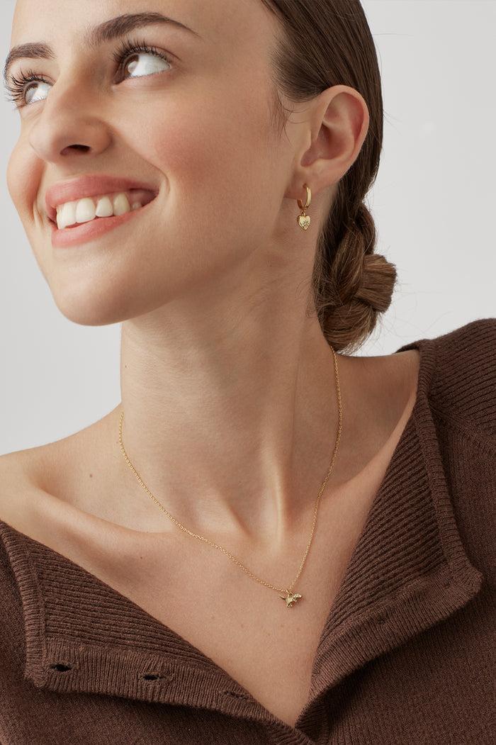 Estella Bartlett Dinosaur Necklace Gold Plated Packaging Message: You're Roarsome