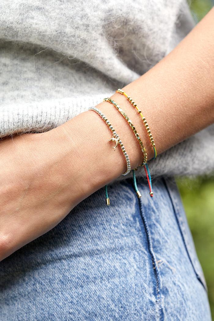 Estella Bartlett Dolphin Sienna Bracelet Silver And Gold Plated Packaging Message: Escape The Ordinary