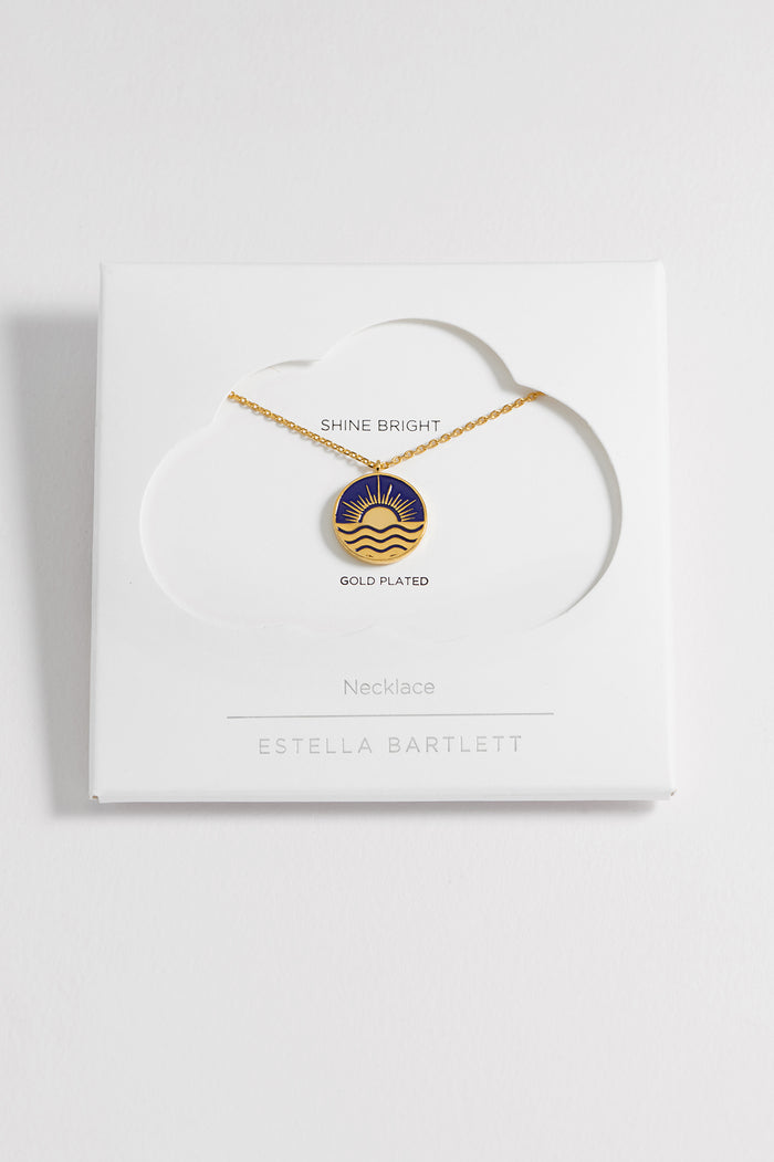 estella bartlett Enamel Sun Pendant Necklace Gold Plated | Navy Packaging Message: SHINE BRIGHT