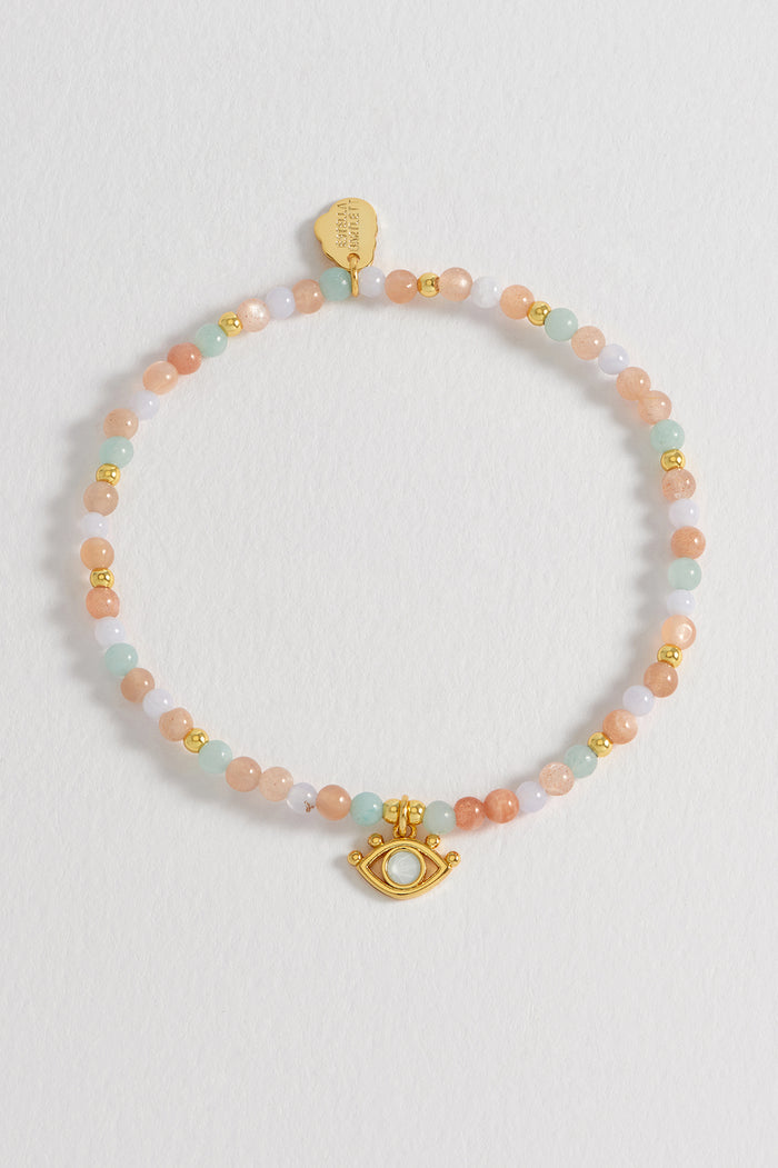 Estella Bartlett Evil Eye Charm Bracelet Gold Plated | Peach Moonstone And Lime Aventurine Packaging Message: GODDESS ENERGY