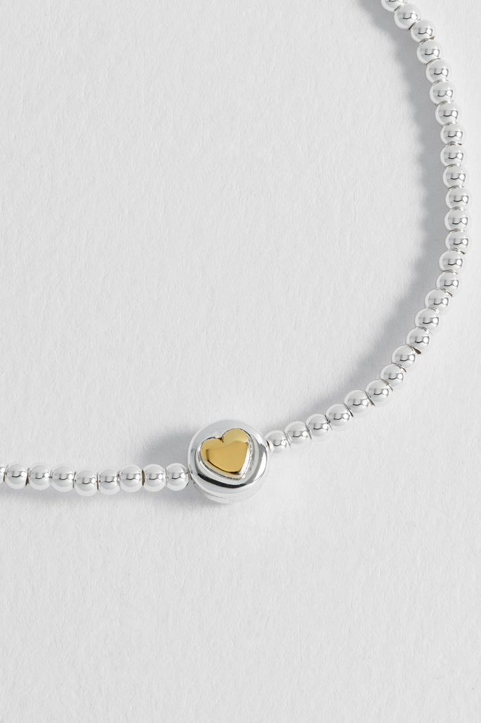 Estella Bartlett Heart Disc Bead Bracelet Silver Plated Packaging Message: All Your Need Is Love