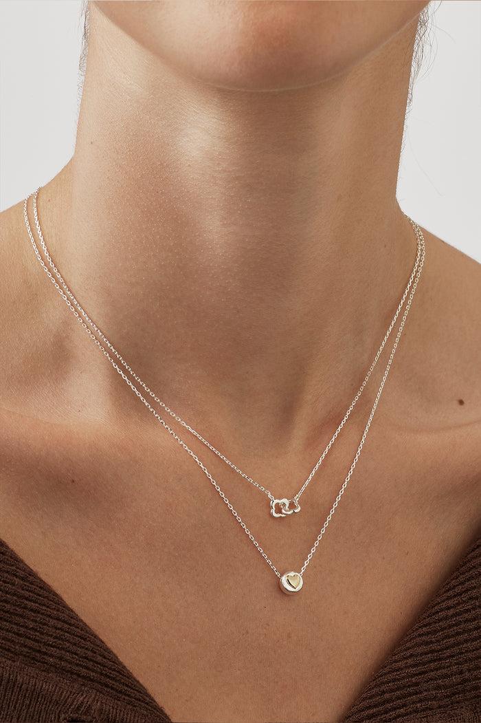 Estella Bartlett Heart Disc Bead Necklace Silver Plated Packaging Message: All You Need Is Love