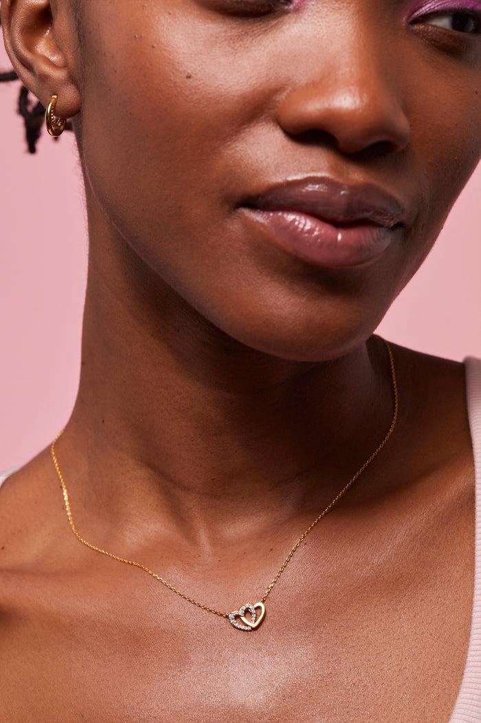 Estella Bartlett Interlocking Heart CZ Necklace Gold Plated Packaging Message: Soft Heart Sweet Soul