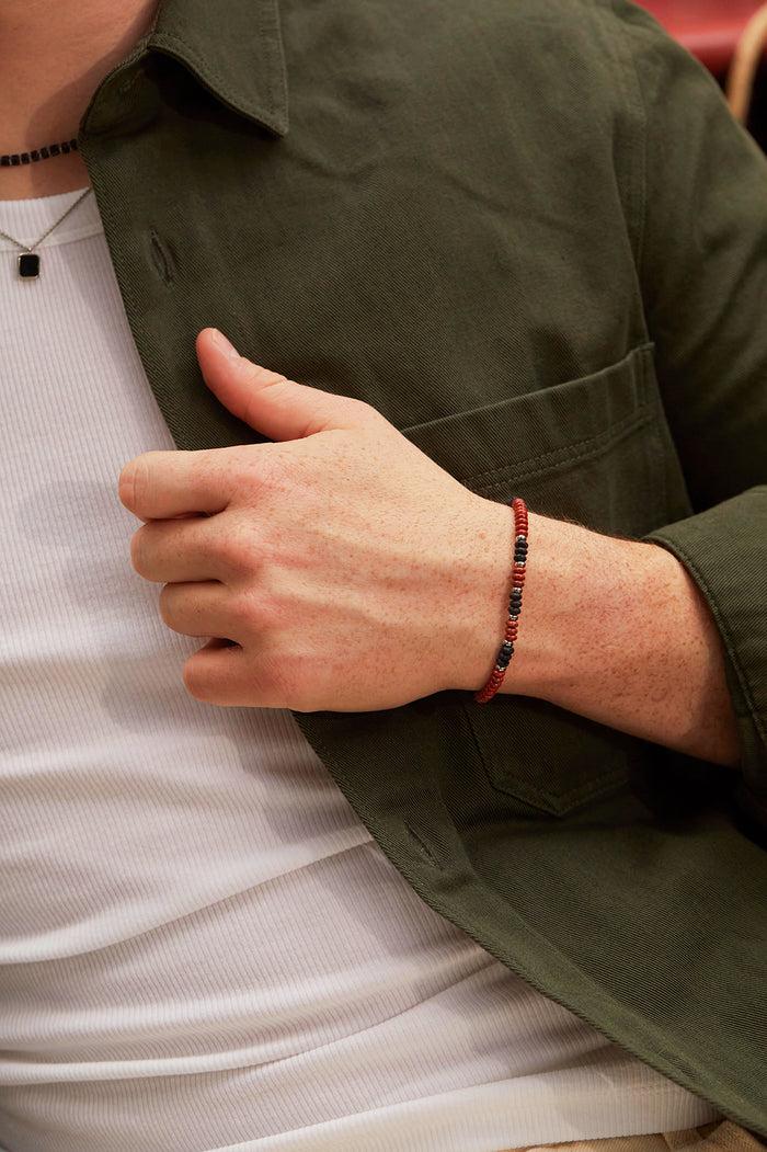 Estella Bartlett Men's Gemstone Stretch Disc Bracelet Waterproof PVD Rhodium Plated | Red Jasper And Black Lava