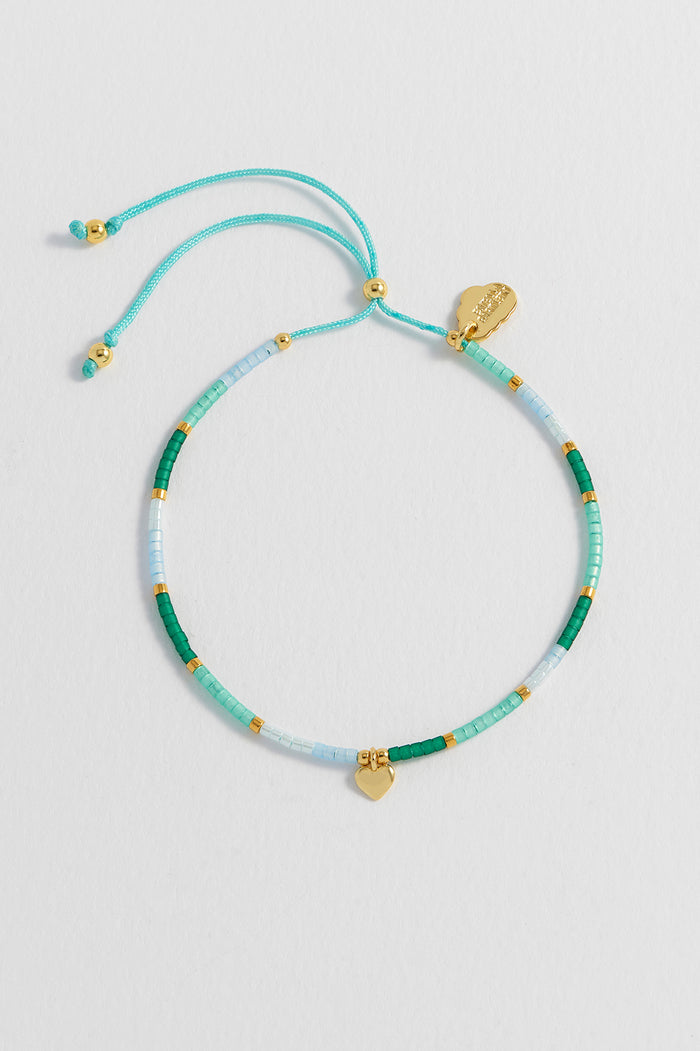 estella bartlett Mini Heart Miyuki Bracelet Gold Plated | Green Packaging Message: She Believed She Could So She Did