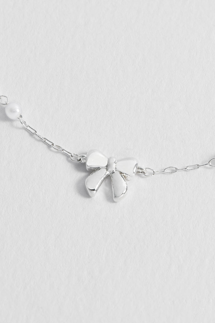 Estella Bartlett Pearl Bow Beaded Chain Bracelet Silver Plated Packaging Message: DEAR DARLING