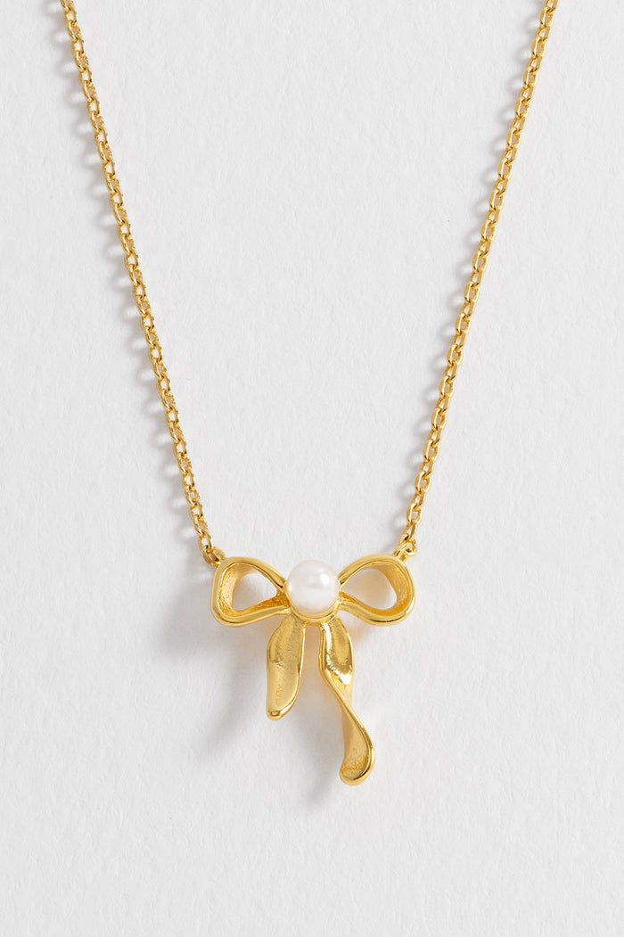 Estella Bartlett Pearl Bow Necklace Gold Plated | Pearl Packaging Message: LOVELY LITTLE THINGS