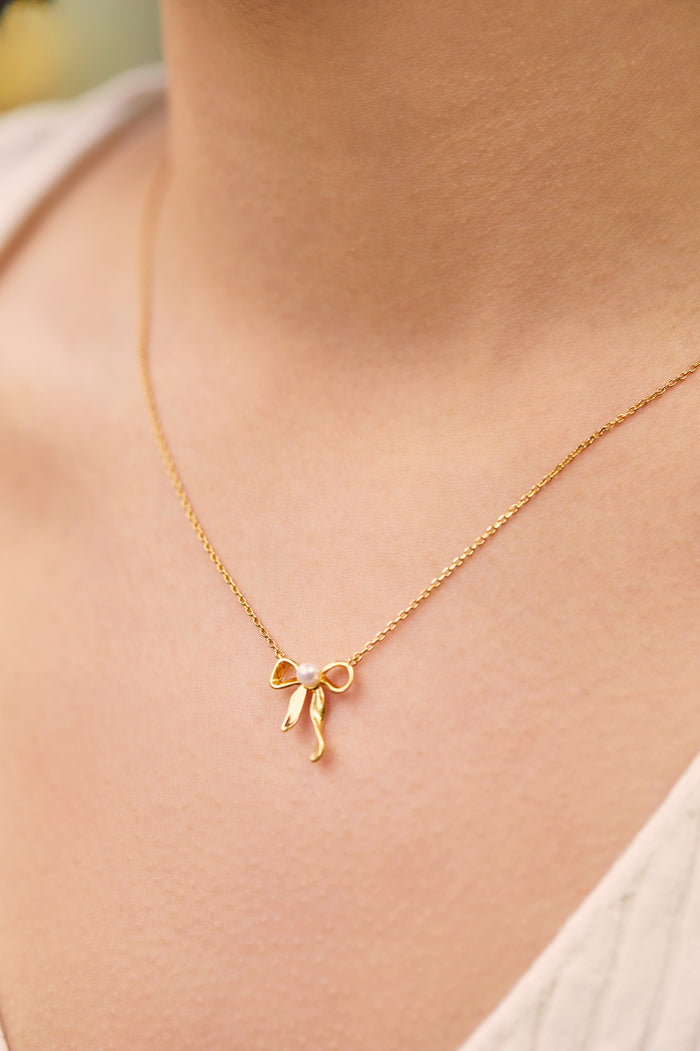 Estella Bartlett Pearl Bow Necklace Gold Plated | Pearl Packaging Message: LOVELY LITTLE THINGS