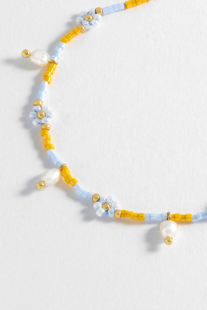 Estella Bartlett Pearl Flower Miyuki Bracelet Gold Plated | Pearl Lilac And Yellow Packaging Message: Follow The Fun