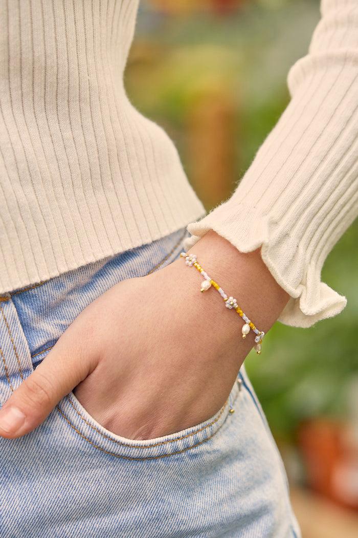 Estella Bartlett Pearl Flower Miyuki Bracelet Gold Plated | Pearl Lilac And Yellow Packaging Message: Follow The Fun