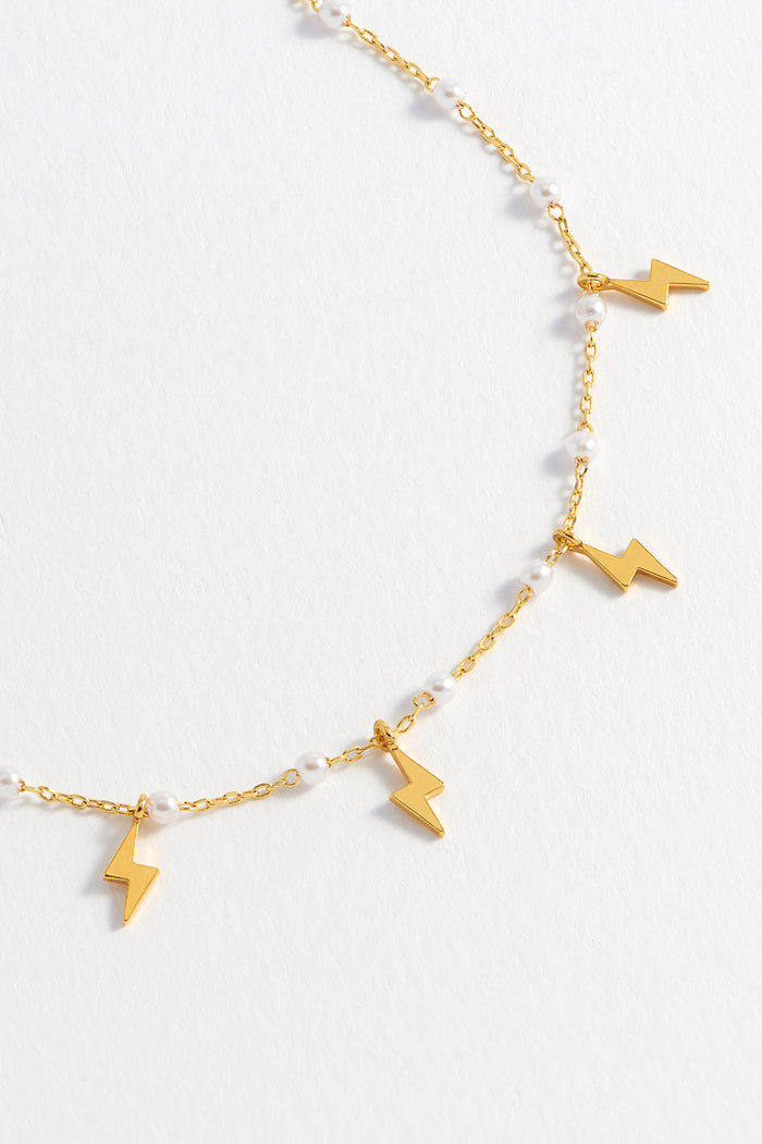 Estella Bartlett Pearl Power Bolt Charm Necklace Gold Plated | Pearl Packaging Message: I Am Powerful