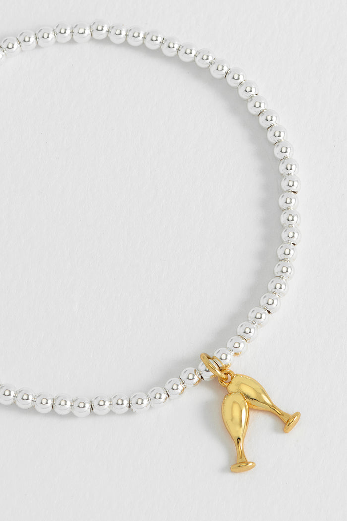 Estella Bartlett Sienna Beaded Champagne Charm Bracelet Gold And Silver Plated Packaging Message: LET'S CELEBRATE