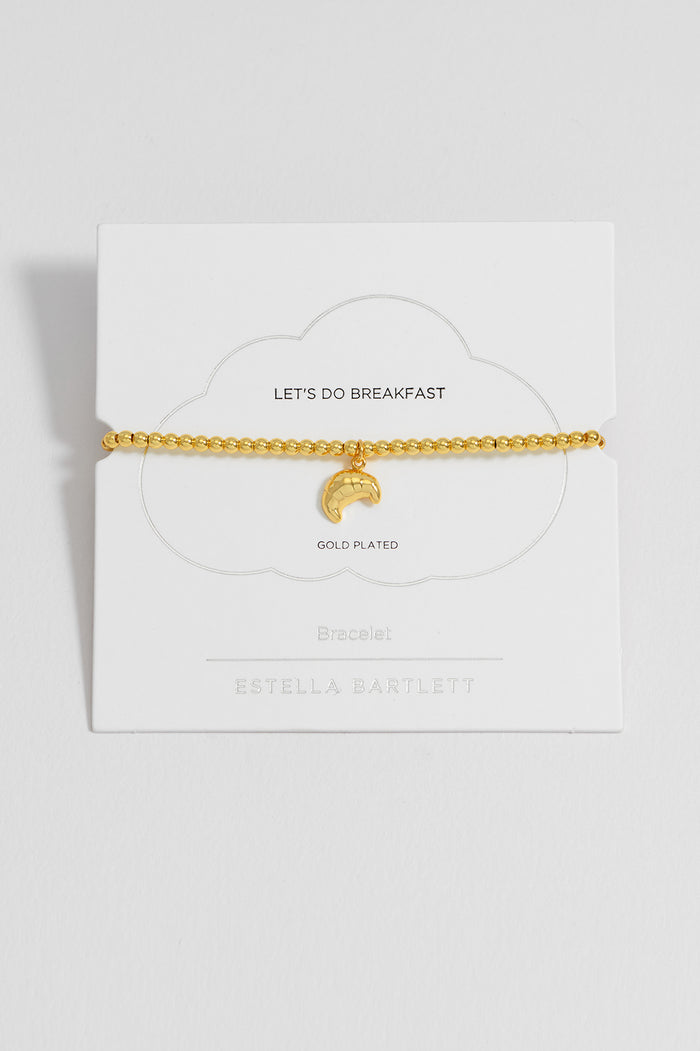 estella bartlett Sienna Beaded Croissant Charm Bracelet Gold Plated Packaging Message: LET'S DO BREAKFAST