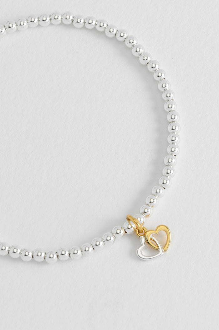 Estella Bartlett Sienna Beaded Interlinked Heart Charm Bracelet Gold And Silver Plated Packaging Message: FRIENDS FOREVER