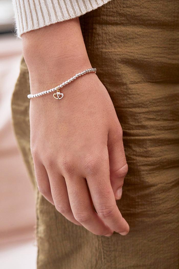 Estella Bartlett Sienna Beaded Interlinked Heart Charm Bracelet Gold And Silver Plated Packaging Message: FRIENDS FOREVER