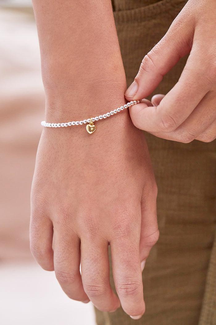 Estella Bartlett Sienna Beaded Puffy Heart Charm Bracelet Gold And Silver Plated Packaging Message: WITH LOVE