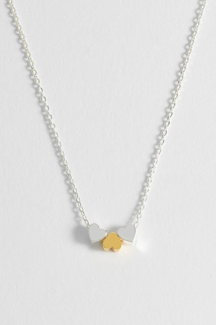 Estella Bartlett Trio Heart Necklace Silver And Gold Plated Packaging Message: Love