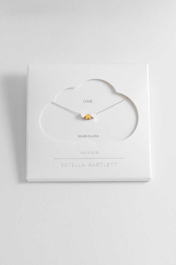 estella bartlett Trio Heart Necklace Silver and Gold Plated Packaging Message: Love