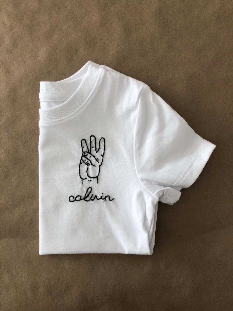 etsy Birthday T-Shirt personalized birthday t shirt embroidered kid birthday shirt first birthday gift child age hand embroidered tee this many