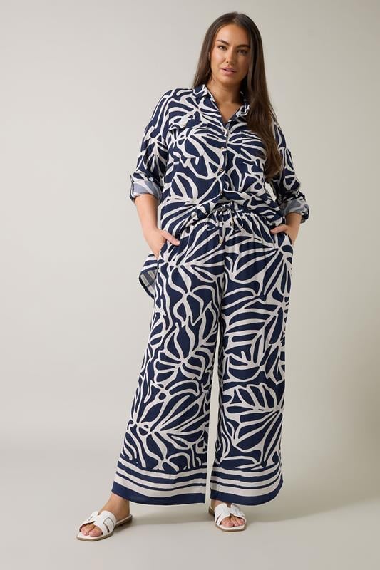 Evans EVANS Curve Navy Blue Palm Border Print Trousers
