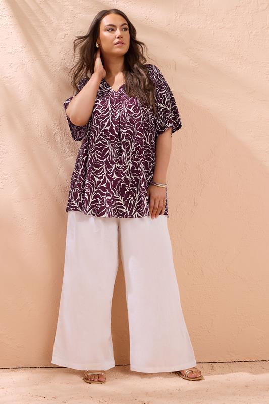 Evans EVANS Curve Purple Abstract Floral Swing Top