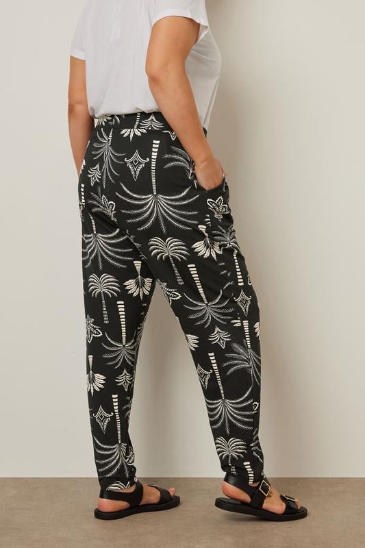 Evans YOURS Curve Black Palm Print Harem Trousers