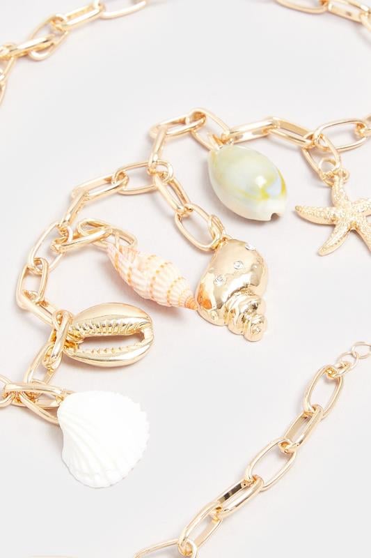 Evans Yours Gold Tone Shell Charm Droplet Necklace