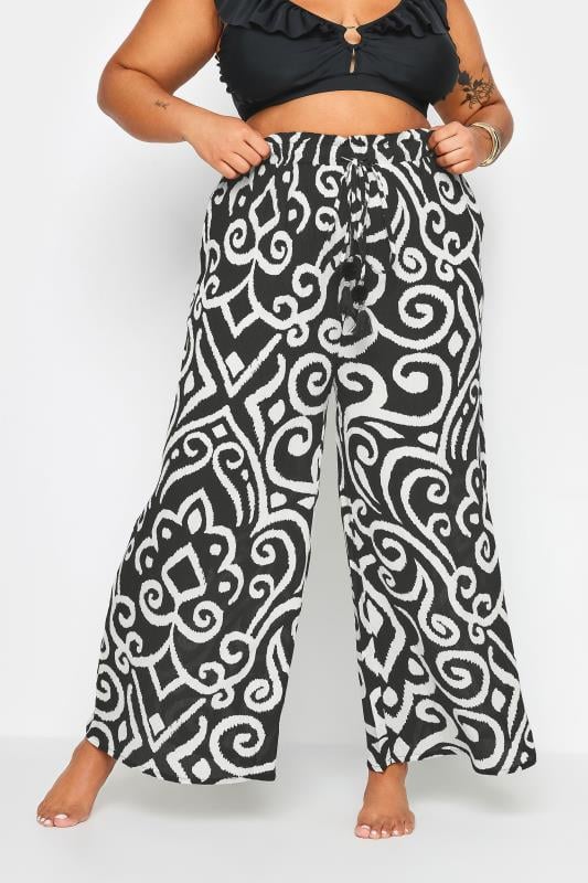evans YOURS Curve Black Abstract Print Crinkle Tassel Trousers