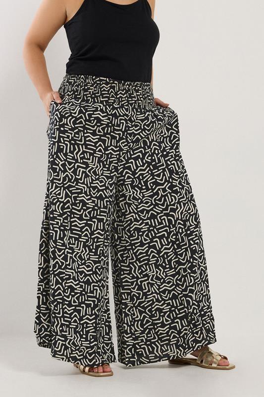 Evans YOURS Curve Black Abstract Print Shirred Waist Trousers