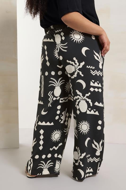 Evans YOURS Curve Black Abstract Print Twill Wide Leg Trousers