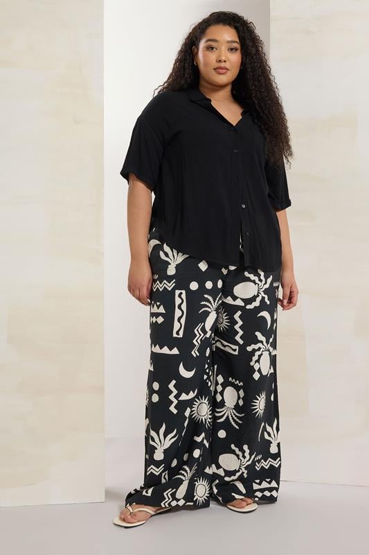 Evans YOURS Curve Black Abstract Print Twill Wide Leg Trousers