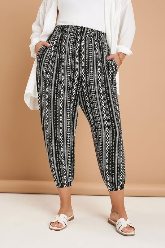 evans YOURS Curve Black Aztec Stripe Cropped Harem Trousers