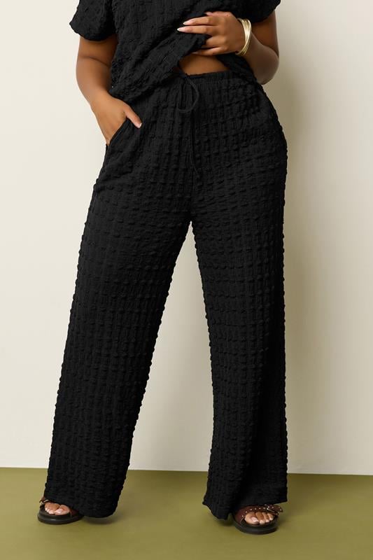 evans YOURS Curve Black Bubble Textured Wide Leg Trousers