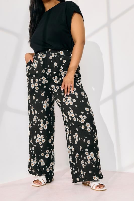 Evans YOURS Curve Black Daisy Print Wide Leg Trousers