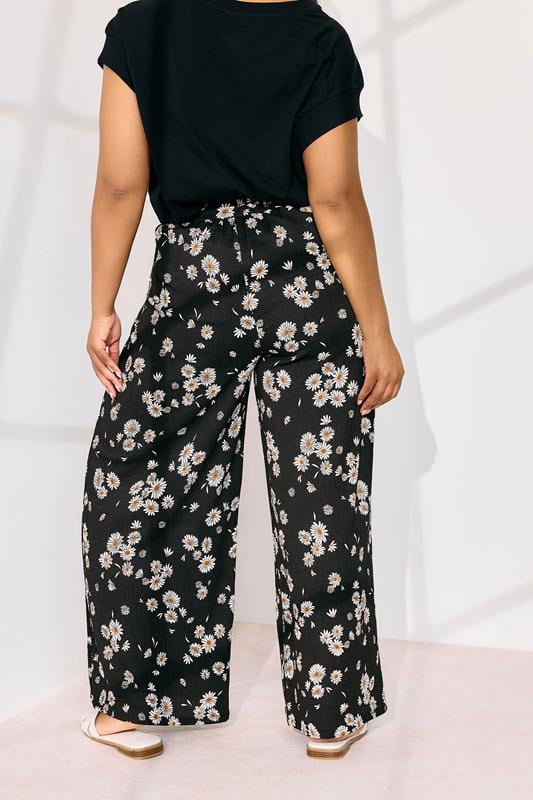 Evans YOURS Curve Black Daisy Print Wide Leg Trousers